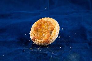 Mushroom Vol au vent isolated on blue background side view of savory snack food photo