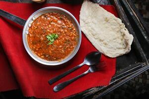 Lobiya masala, loba red beans with bread served in dish isolated on red mat top view on table arabic food photo