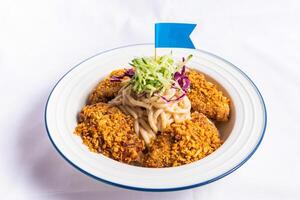 Typhoon Shelter Chicken Wing with fish noodle soup served on bowl isolated on napkin side view of fastfood photo