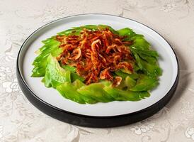 Stir-fried Cold Melon Slices with Cherry Blossom Shrimp served dish isolated on background top view of hong kong chinese food photo