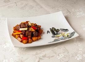 Braised Beef Fillet with Potato Wedges served dish isolated on background top view of hong kong chinese food photo