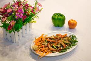 Mushroom vegetables with carrot, tomato and bell pepper served in dish isolated on table side view of indian spices food photo