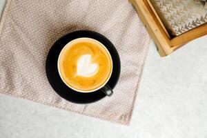 Coffee Latte art served in cup include sugar, milk isolated on napkin top view cafe breakfast hot drink photo