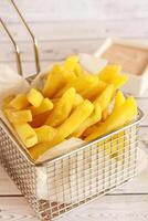 FRENCH FRIES Bucket Closeup served in dish isolated on table side view of arabic fastfood photo