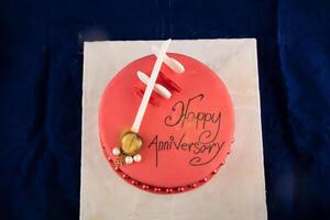 Happy anniversary Red Pearl Cake or women day and valentine celebration served on board isolated on napkin top view of cafe bake food photo