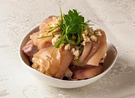 Pork Knuckle with Ginger and Scallion Oil served dish isolated on background top view of hong kong chinese food photo