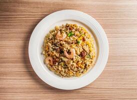 yangzhou fried rice with shrimp, prawn and eggs served in dish isolated on table top view of hong kong food photo