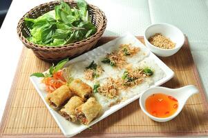 Spring Rolls with Marina with chilli sauce served in dish isolated of table top view fast food snacks photo