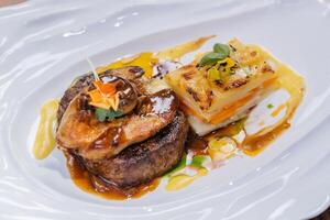 Tournedos Rossini or Tornedos served in dish isolated on table top view of meat main course arabic food photo