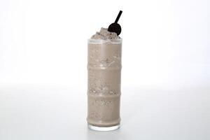 Oreo Shake with straw served in glass isolated on grey background side view of healthy morning arabic drink photo