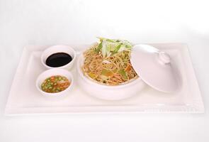 VEGETABLE HAKKA NOODLE with bell pepper and spring onion and sauce served in dish isolated on background side view of arab food photo