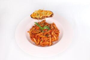 NAPOLITANA Pasta with garlic bread and tomato cherry served in dish isolated on background side view of arab food photo