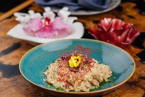 Risotto ai Funghi Porcini Pasta served in plate isolated on table side view of italian fastfood photo