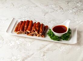 Nostalgic Fried Large Intestines with say sauce served dish isolated on background top view of hong kong chinese food photo