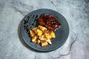 Moroccan Tagine Chicken with boiled potatoes served in plate isolated on background top view of breakfast food indian spices photo