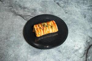Chicken puff roll served in plate isolated on background top view of baked food indian dessert photo