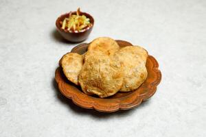 served in dish isolated on table top view of indian, bangladeshi and pakistani street food photo