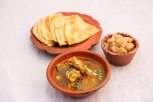 desi breakfast Mutton nalli nihari, Halwa and paratha served in dish isolated on background top view of bangladesi breakfast photo