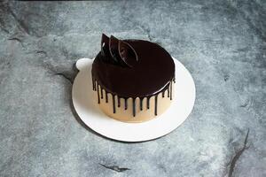 Chocolate Mocha cake served in plate isolated on background top view of baked food indian dessert photo