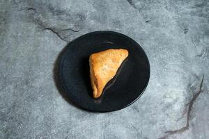 Creamy chicken mushroom puff pastry snack served in plate isolated on background top view of baked food indian dessert photo