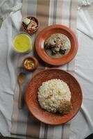 with salad, borhani and boodi rabri served in dish isolated on mat top view of indian and bangladeshi food photo
