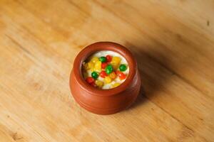 Moondi rabri milk kheer served in pot isolated on mat top view of indian, bangali and pakistani dessert mithai photo