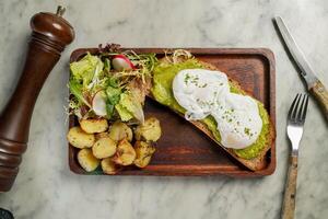 Smashed Avocado on Toast served in dish isolated on marble background top view on hong kong food photo