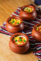 Moondi rabri milk kheer served in pot isolated on mat top view of indian, bangali and pakistani dessert mithai photo