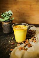 Badam sharbat, Almond milk syrup with saffron served in glass isolated on table top view of drink photo