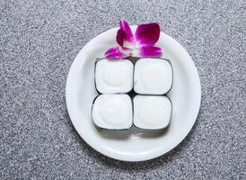 sago cake with coconut milk in pandanus leaf served in dish isolated on grey background top view of hong kong food photo