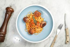 chicken pasta spaghetti bolognese served in dish isolated on marble background top view on hong kong food photo