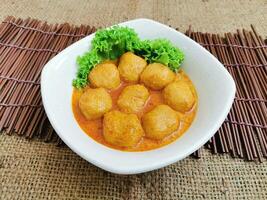 Curry Fish Ball served dish isolated on table top view of thai food photo