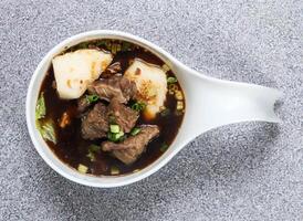 stewed beef flank in thai style served in dish isolated on grey background top view of hong kong food photo