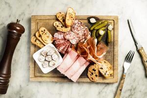 Selection of Cold Cuts served in dish isolated on marble background top view on hong kong food photo