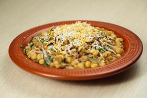 Spicy chotpot masla chaat with chana, chola, chilli served in dish isolated on table top view of indian, bangladeshi and pakistani street food photo