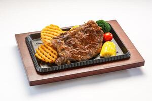 Air Fryer Sirloin Steak with corn, tomato and broccoli served in dish isolated on wooden table side view of hong kong fast food photo