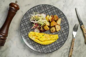 Ham and Cheese Omelette with potato served in dish isolated on marble background top view on hong kong food photo