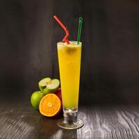 Apple Orange Juice with straw served in glass isolated on table side view healthy morning drink photo