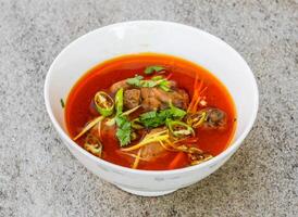 chicken nihari served in dish isolated on background top view of indian spices and pakistani food photo