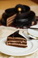 Black Forest Cake slice include chocolate chip, fork, sugar baked served in plate isolated on table side view bake cafe photo