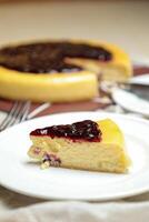 Blueberry Cheesecake slice include caramel with fork and knife served in plate isolated on table top view of cafe bake food photo