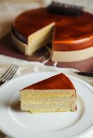 Mocha cake slice include chocolate, cream, sugar with knife and fork served in plate side view of cafe food photo