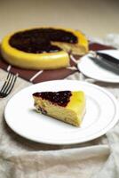 Blueberry Cheesecake slice include caramel with fork and knife served in plate isolated on table top view of cafe bake food photo