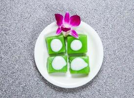 Japanese warm layer cake served in dish isolated on grey background top view of hong kong food photo