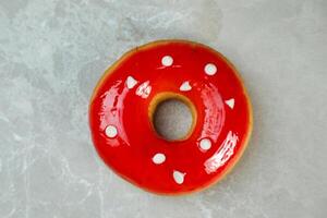 Strawberry Glazed Donut served in plate isolated on grey background top view of baked food breakfast on table photo