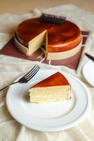 Mocha cake slice include chocolate, cream, sugar with knife and fork served in plate side view of cafe food photo