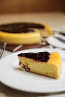 Blueberry Cheesecake slice include caramel with fork and knife served in plate isolated on table top view of cafe bake food photo