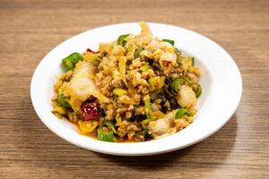 Spicy Pig fish Alliance served in dish isolated on mat top view on wooden table Hong Kong food photo