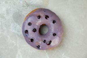 Fresh Blueberry Donut Isolated on grey background top view of baked breakfast food photo