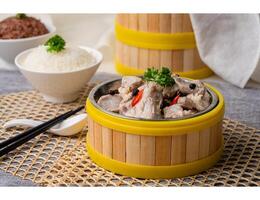 STEAM PORK IN BEAN SAUCE with chopsticks served in dish isolated on table top view of singapore food photo